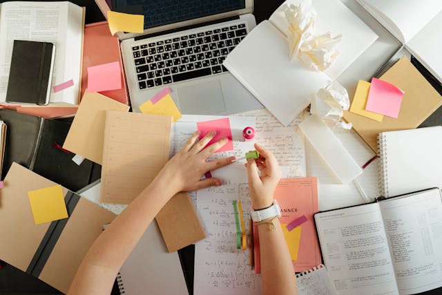 A creative entrepreneur brainstorming product ideas for selling on Gumroad.